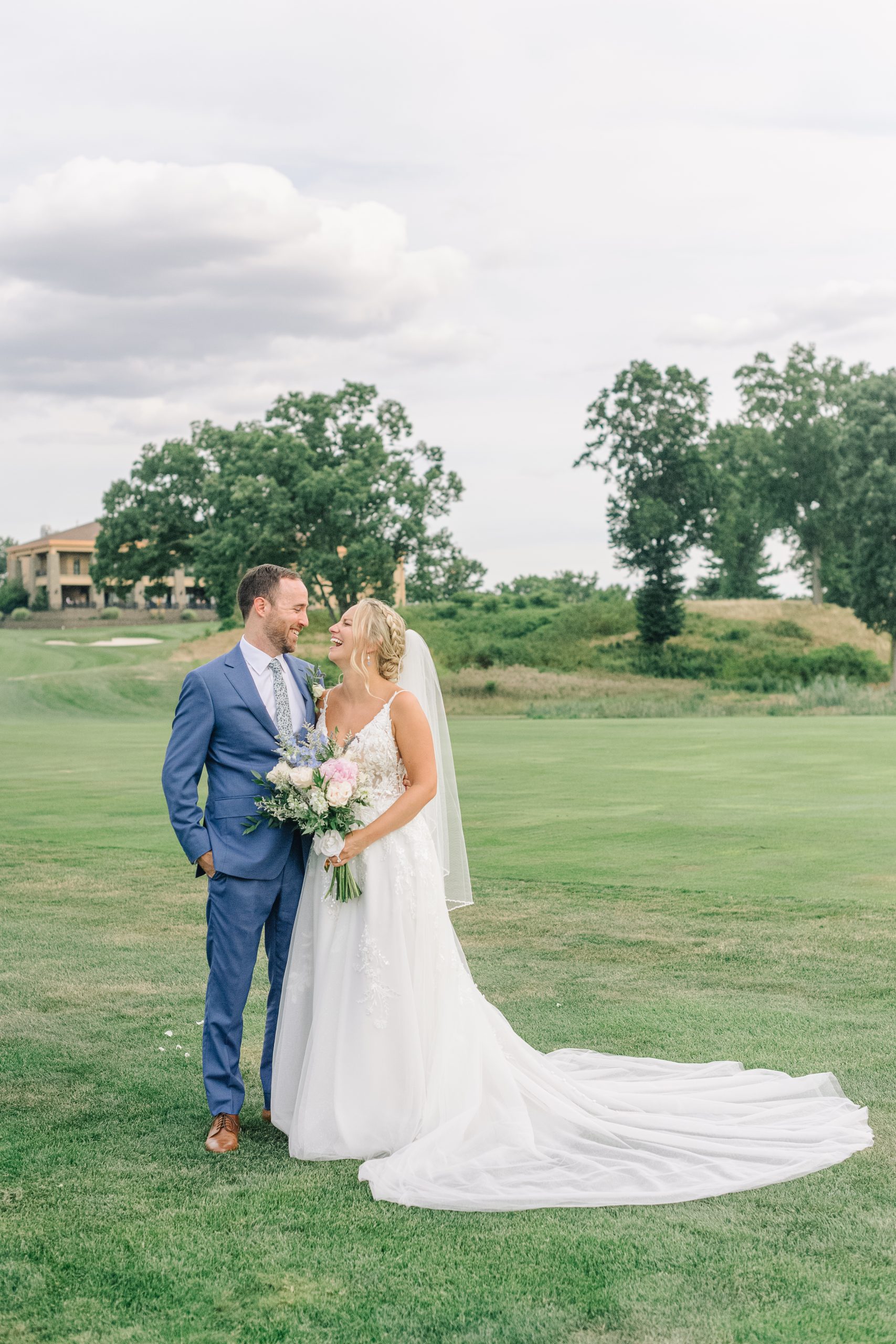 A bride and groom on the golf course at The Clubhouse at Galloping Hill in Kenilworth, New Jersey